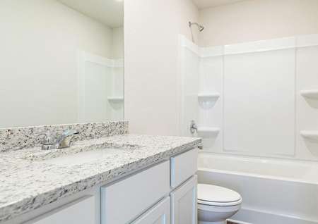 The guest bathroom has a large vanity and ready for your guests