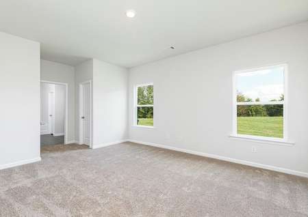 The master bedroom is spacious with two large windows
