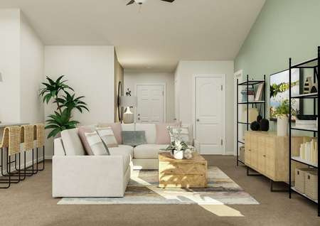 Rendering of the living room furnished
  with a sectional couch, coffee table, book shelves and media center.