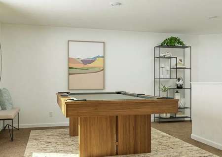Rendering of loft area with pool table,
  storage shelves, and artwork on wall.