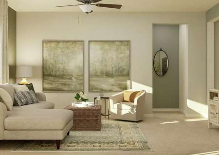 Rendering of the living room with the
  window and couch on the left, two large art pieces in the center and the
  mounted tv on the right.