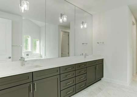 The master bath has a stunning dual-sink vanity.