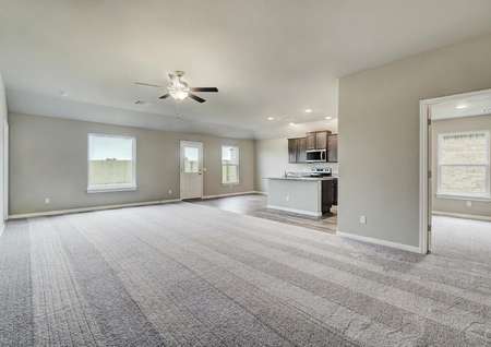 A large family room opening up to the chef-ready kitchen and dining area.