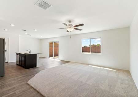 Open-concept layout with a spacious living room, designer kitchen, and breakfast area.