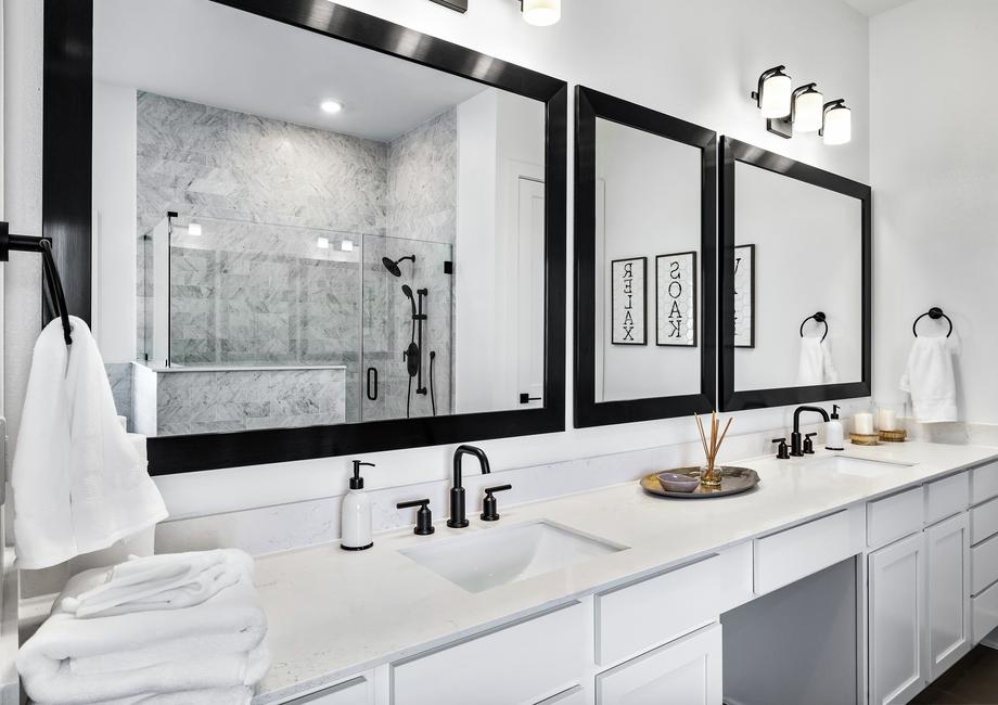 Beautiful master bathroom with large mirrors and a double-sink vanity.