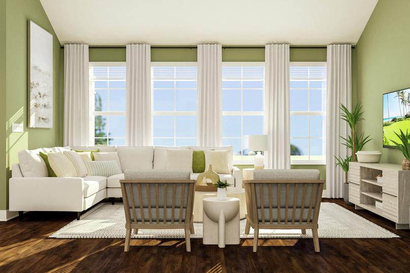 Rendering of living room area showing a
  white sectional couch along a green accent wall and large windows, a coffee
  table and accent chairs, and a media cabinet with tv on the right with dark
  wood look flooring throughout.