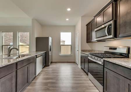 The kitchen has great natural light, stainless steel appliances and stunning granite countertops.