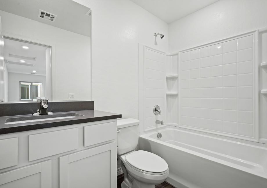 Secondary bathroom with a tub/shower combo