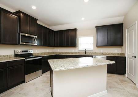 Large kitchen with granite island and countertops