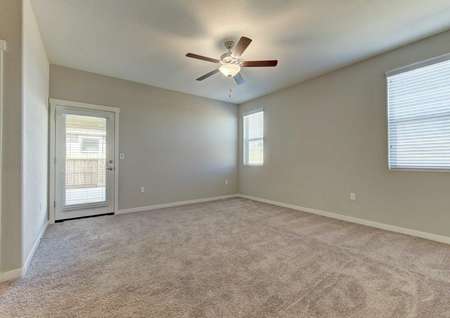 Cooley single-family home inside with light carpeting, white accent paint, and ceiling fan
