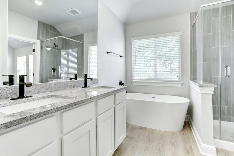 The master bathroom feels like a spa retreat with its soaking tub and walk-in shower.