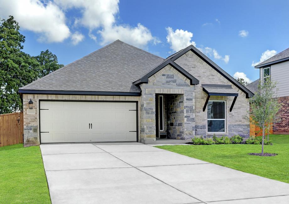 Exterior of the Connally with light gray brick and stone, professional landscaping, and a two-car garage.