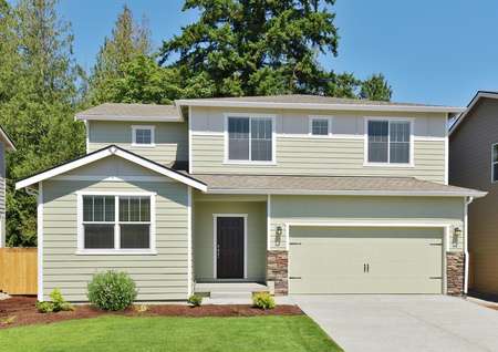 Exterior photo of the Henry plan by LGI Homes with pale green siding and water table stone at garage.