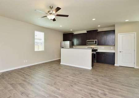 Fox great room with hardwood floors, wood cabinets in the kitchen, and overhead ceiling fan