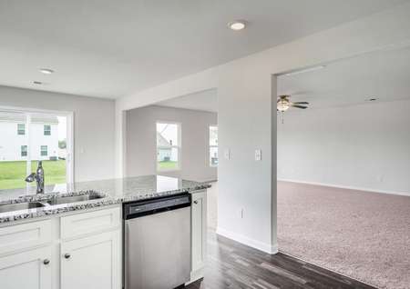 Chef-ready kitchen overlooks the breakfast area and the spacious living room.