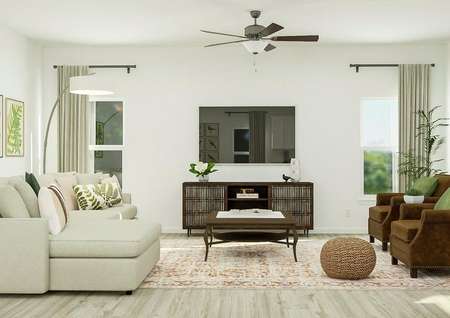 Rendering of the living room showing a
  television and media cabinet centered between two windows. On one side of the
  room is the large couch and opposite it are two armchairs.
