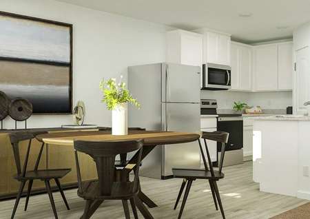 Rendering of kitchen area with round
  table, large storage space and large artword above storage.