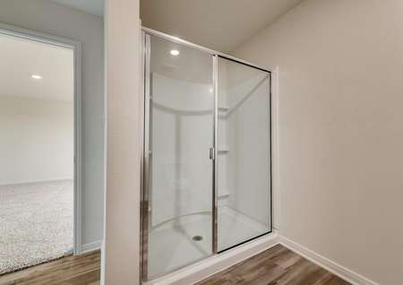 The master bath comes with an extended glass enclosed shower.