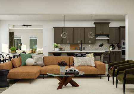 Rendering of the Thunderbird's spacious  open floor plan. Modern furniture finishes the living area, and a view of the  designer kitchen is in the background.