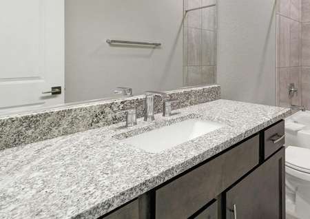 Hawley bathroom with custom backsplash bath/shower, undermount sink, and granite vanity