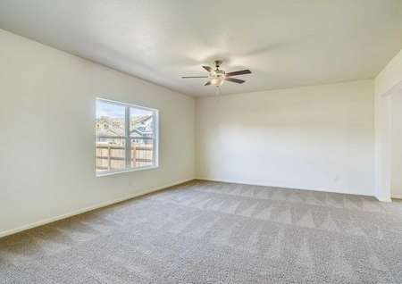 Spacious living room with ceiling fan and access to the flex room. 
