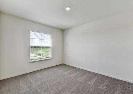 Frio dining room featuring carpet, ceiling light and window with blinds.