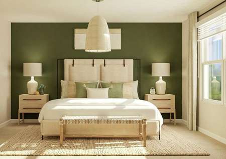 Rendering of a spacious master bedroom
  with a large window, carpeted flooring, two tan walls and a green accent
  wall. The room is furnished with a large bed, a bench at the end of the bed,
  two nightstands and a rug.