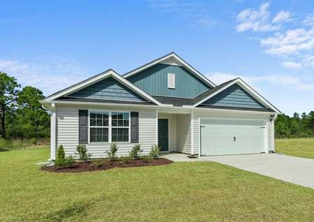 Burton single-family house with two-tone paint finish, green grass, and extended driveway