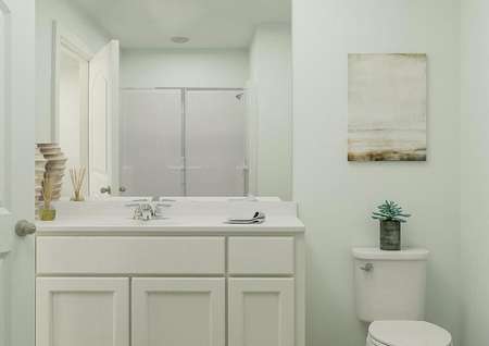 Rendering of a full bath with a white
  cabinet vanity and toilet. A shower is visible in the mirror's reflection.