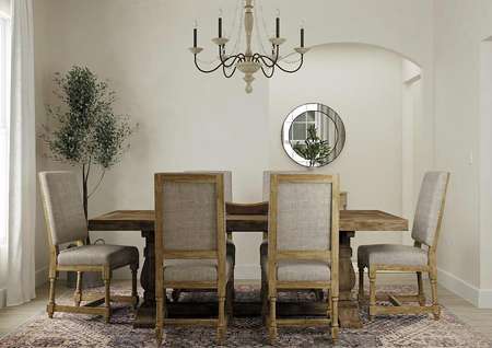 Rendering of the Maple dining room holding a large wooden dining table with six chairs around it. A rug sits on the wood style flooring.