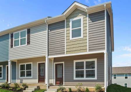 The Birch plan has gray siding accented with tan shake siding.