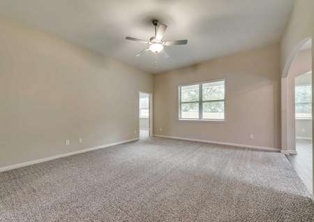 The family room has soaring ceilings and great natural light.