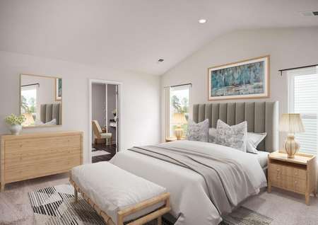 Staged master bedroom with bed, nightstands, lamps, dresser and lamps.