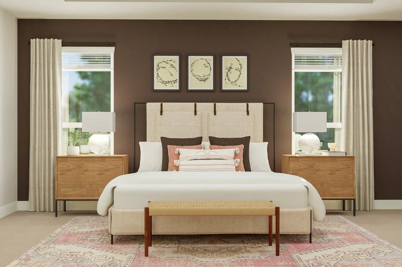 Rendering of the master bedroom focused  on the large bed, two nightstands, rug and bench. An accent wall, paintings,  two table lamps and matching pillows complete the look.