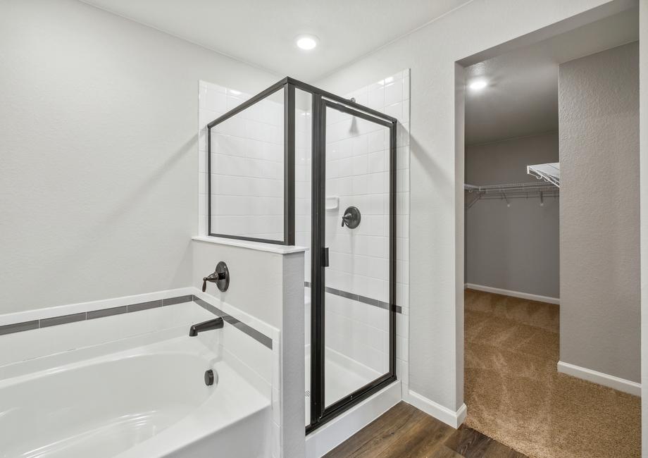 The master bath also features a soaking tub and walk-in shower.