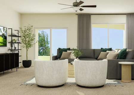 Rendering of the living room looking
  towards the wall containing a large window and a sliding glass door. The room
  is furnished with a sectional couch and two accent chairs.