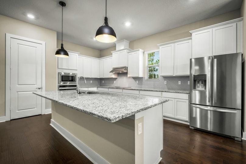 Kitchen with granite countertops and stainless steel appliances.