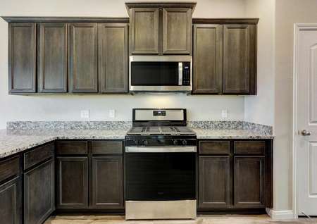 The kitchen comes with a full suite of stainless steel appliances.