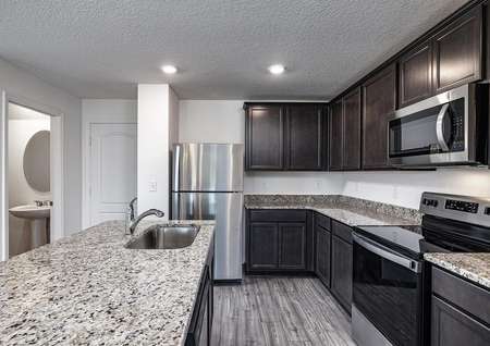 Spacious granite countertops and brand-new kitchen appliances in the heart of the home. 