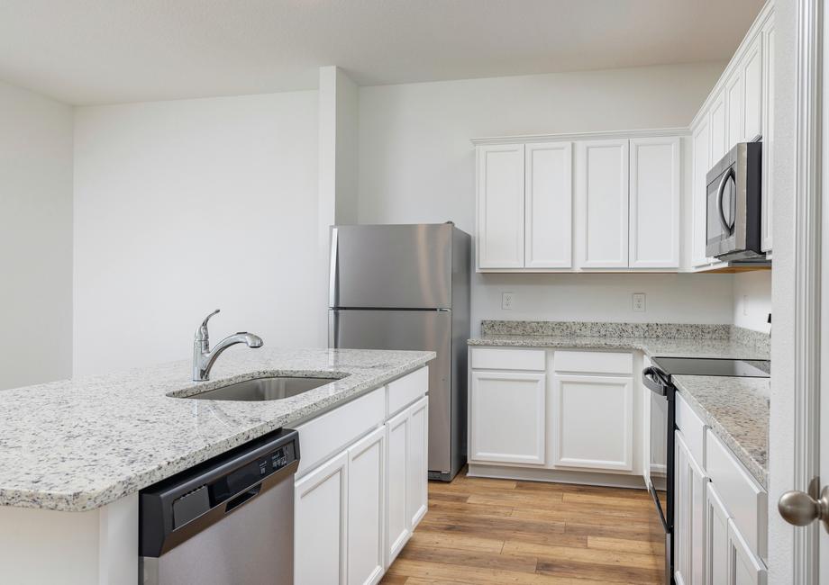 The kitchen is chef-ready with stainless steel appliances included