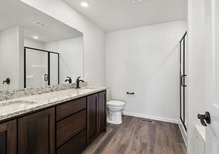 The master bathroom has a double sink vanity