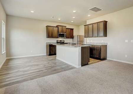 The dining room is open to the chef-ready kitchen in this spacious layout.