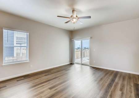Arapaho family room with overhead light/fan, wood flooring, and off white walls with white trim