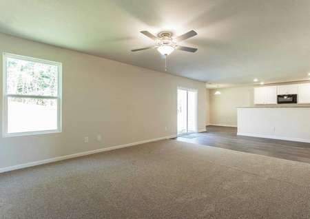 Hartford great room with carpeted family room, tiles kitchen and dining area, and ceiling fan