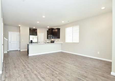 Open layout with kitchen overlooking the family room