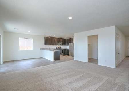 Open-concept layout, featuring a chef-ready kitchen, dining area, and spacious living room.
