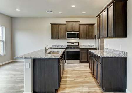 The kitchen has sprawling granite countertops and stainless steel appliances.