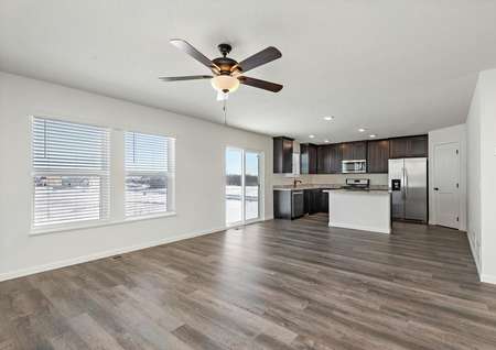 The open-concept entertainment space includes the kitchen, dining, and family room
