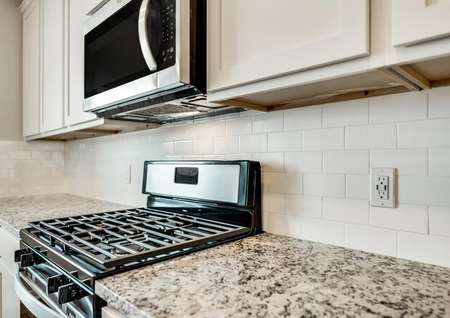 The kitchen offers brand-new, stainless steel kitchen appliances.