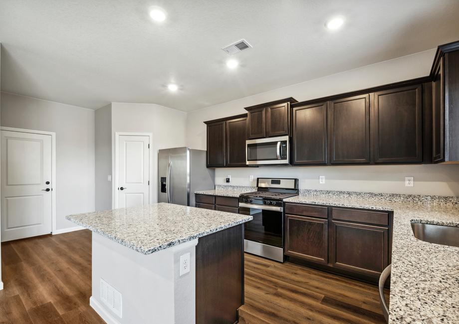 You will love the included stainless appliances and features like the espresso cabinets.